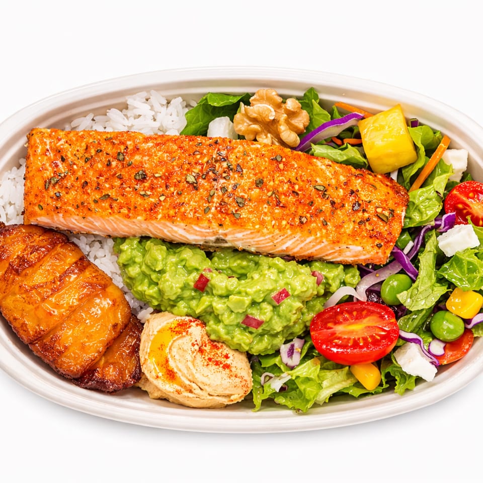A salmon bowl with rice, guacamole, plantains, hummus, and a fresh salad with walnuts.