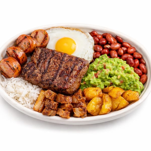 A large white bowl filled with grilled steak, sausages, rice, beans, guacamole, fried potatoes, and chicharron, topped with a sunny-side-up egg.